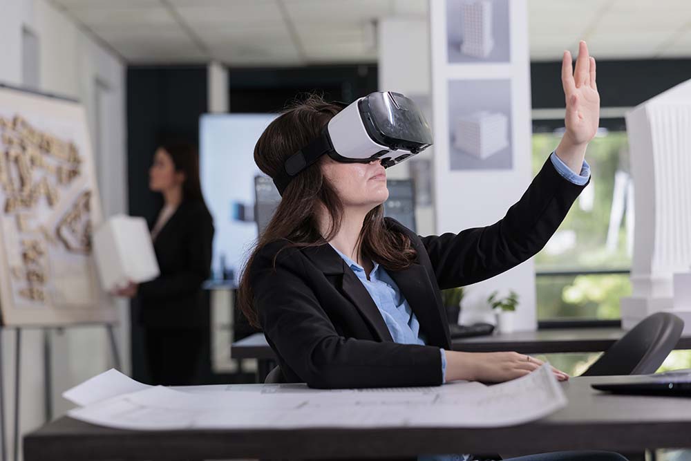 Architect in ar helmet touching virtual building model