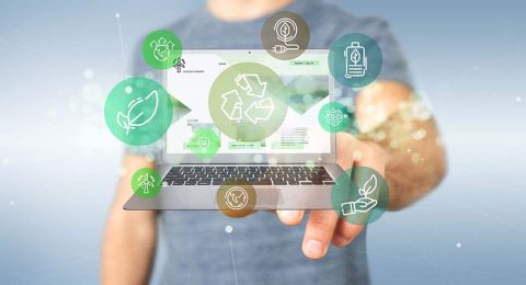 Businessman holding a Cloud of green ecology icon bubble with a laptop 3d rendering