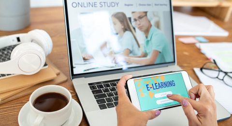Human hands with smartphone signing in educational website