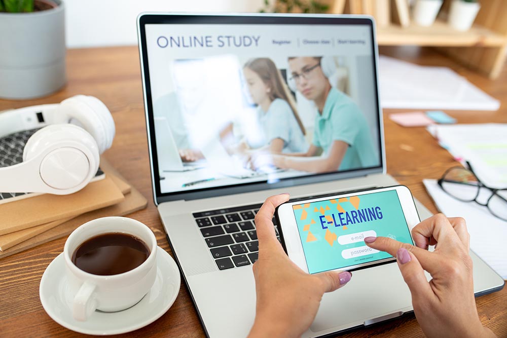 Human hands with smartphone signing in educational website